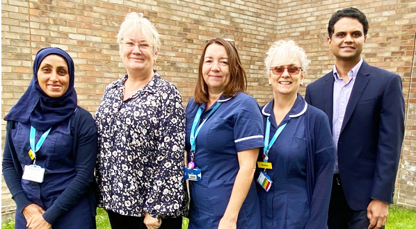 The Gastroenterology team, Jacqueline Roscoe, IBD nurse specialist (centre) and Dr Pushpakaran Munuswamy, Gastroenterology Department Lead (far right). Image taken pre-Covid.