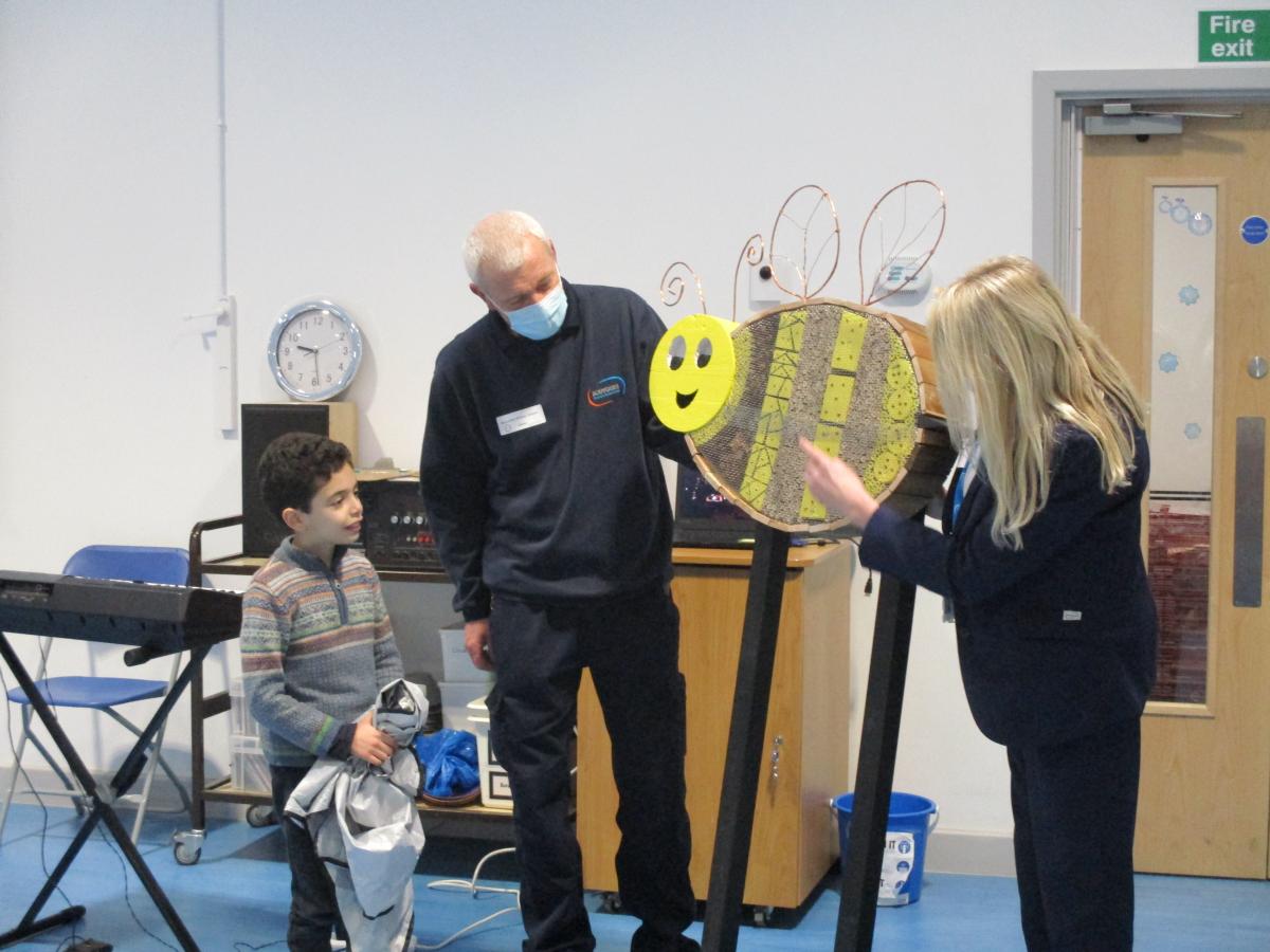 Photo of students from Broomfield Primary School and the creators of the bee garden